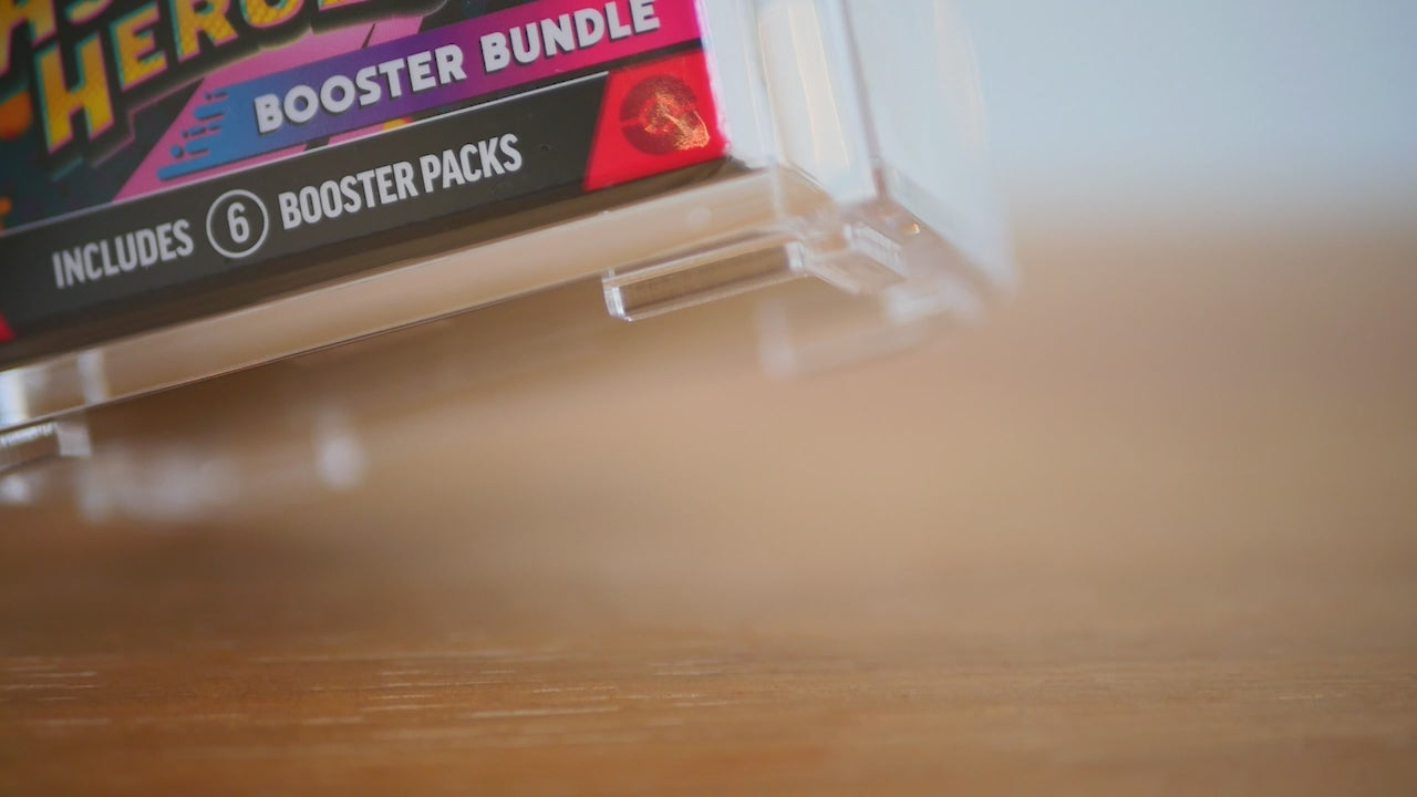 SafeStack™ demonstration showing Safegaard stackable acrylic display cases for 2026 Pokémon booster bundles.